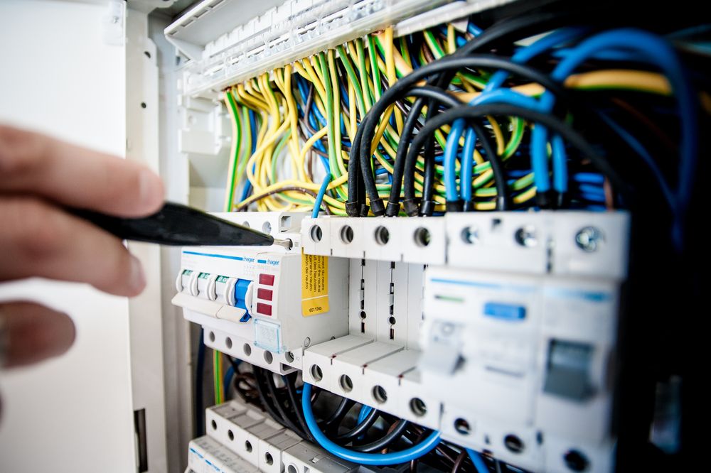 Electrical work on the circuit protection and wiring inside a distribution board