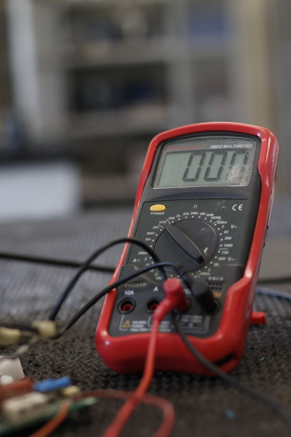 Multimeter on a workshop bench for electrical testing